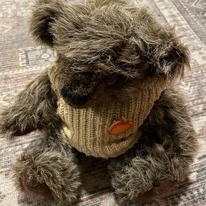 Teddy bear with sweater vest and apple pin